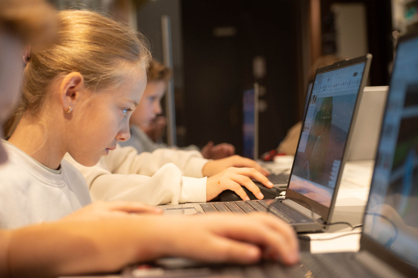 A student working in Roblox Studio during an in-person class